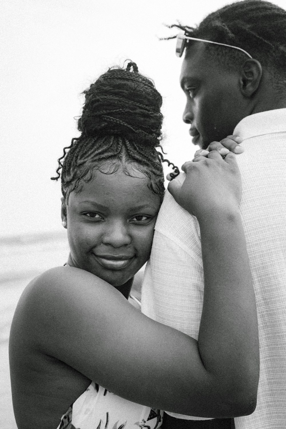 A couple enjoying a warm afternoon together by the water